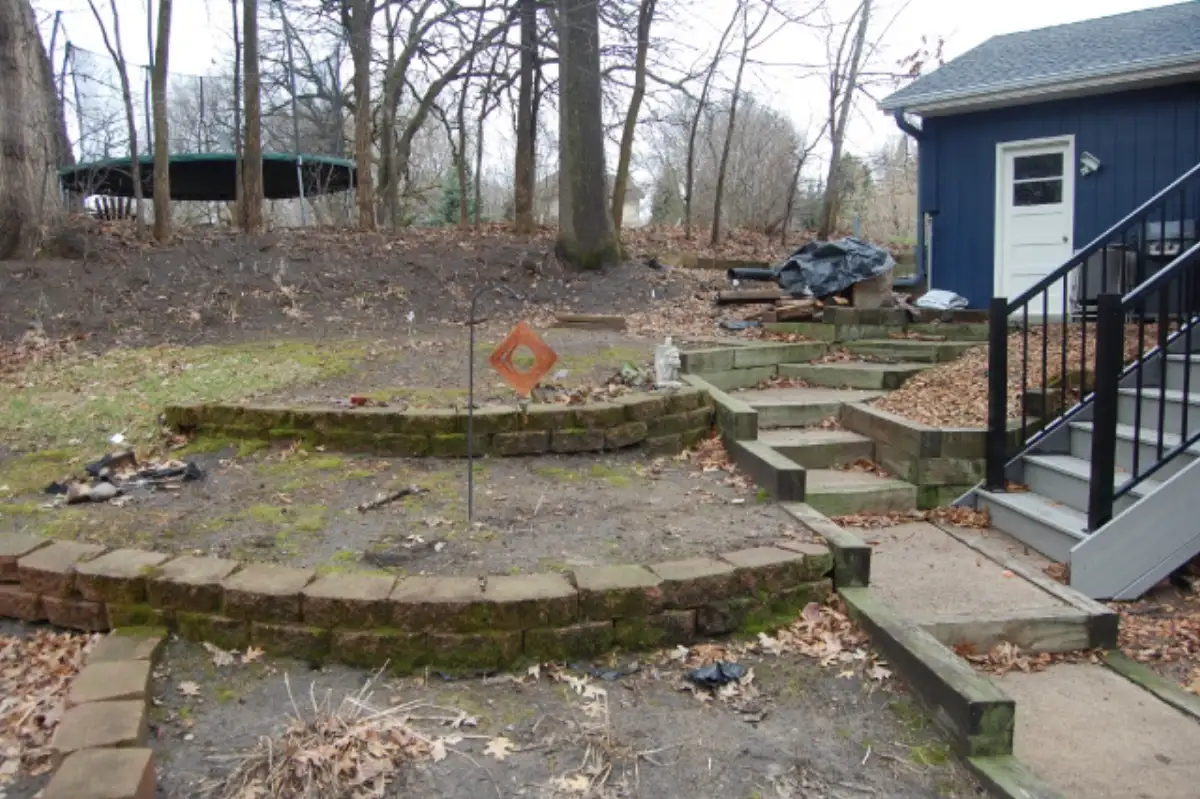 Before: Minnetonka hillside before retaining wall construction