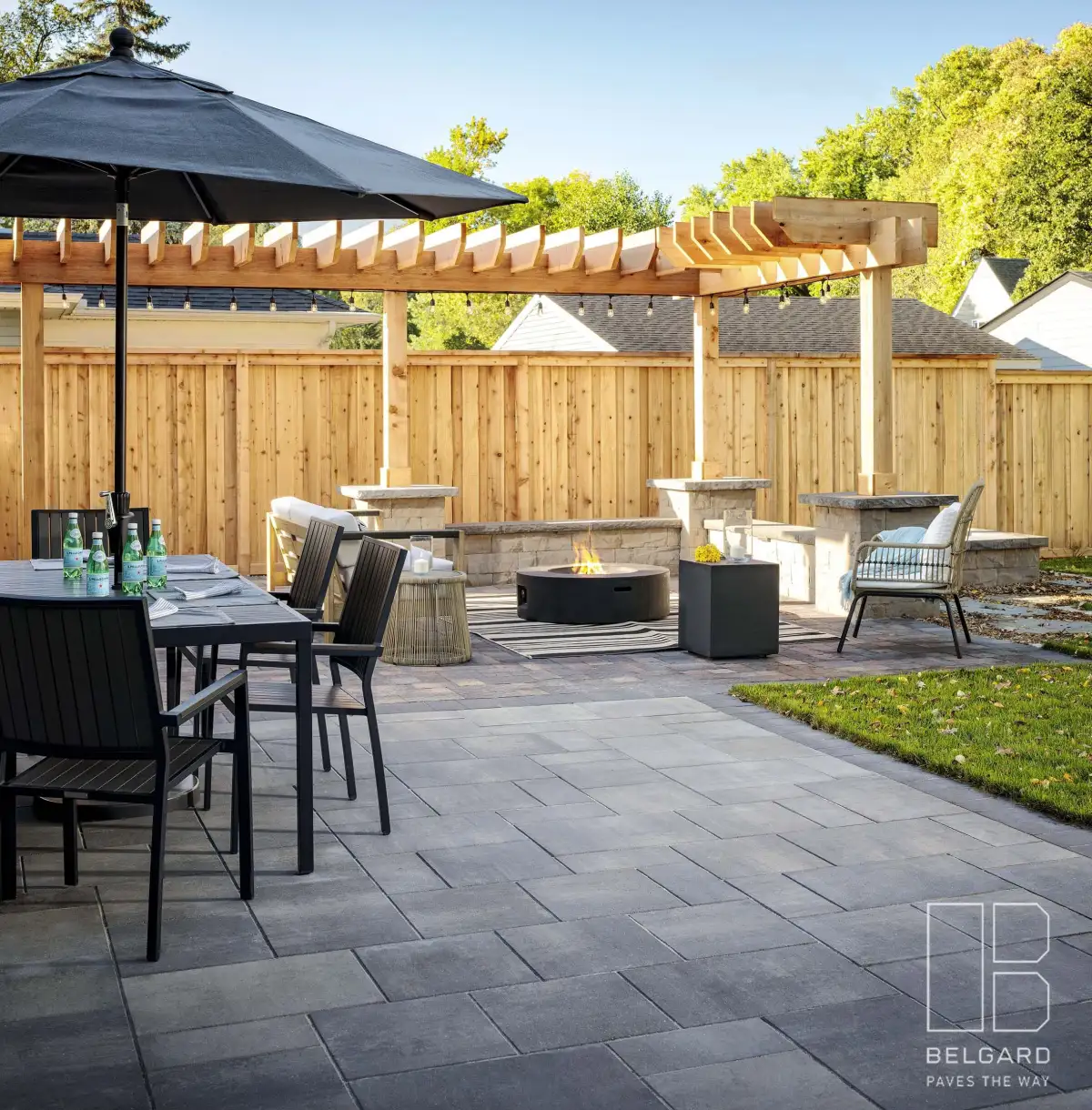 Complete outdoor living space with patio, fire feature, and pergola in St. Louis Park MN