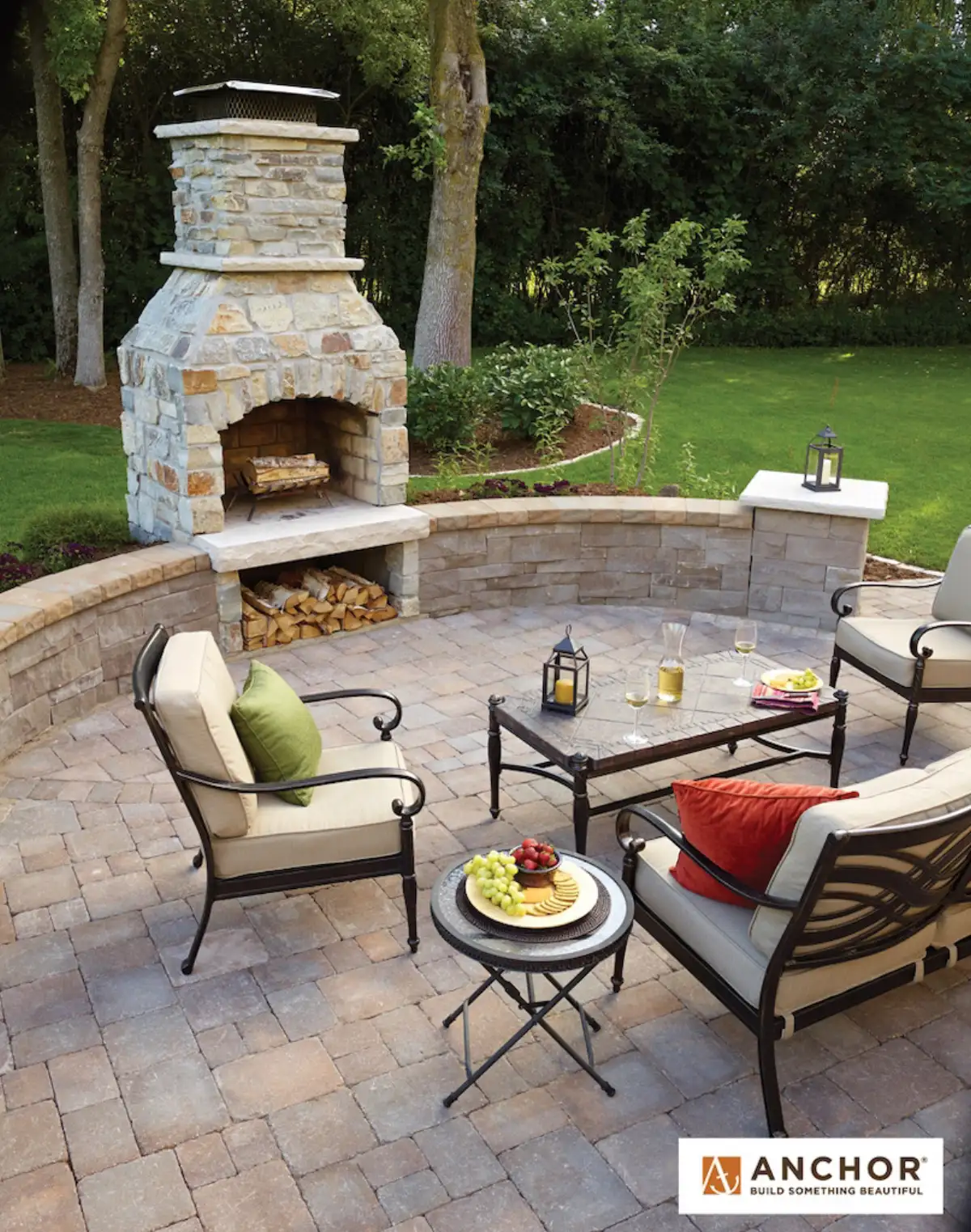 Stone fire pit with seating wall on paver patio in Minnetonka