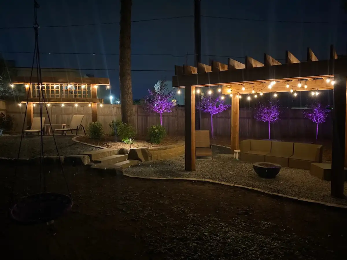 LED uplighting on trees and path lighting along paver walkway in Minnetonka