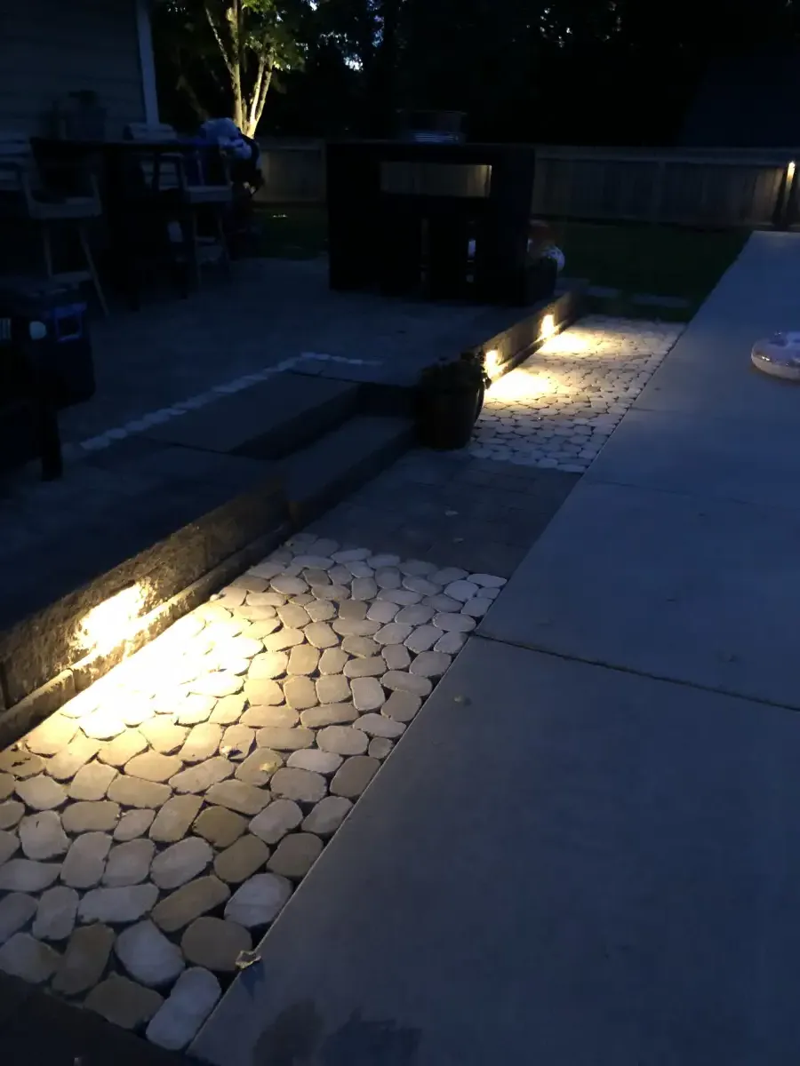 Landscape lighting along patio and retaining walls