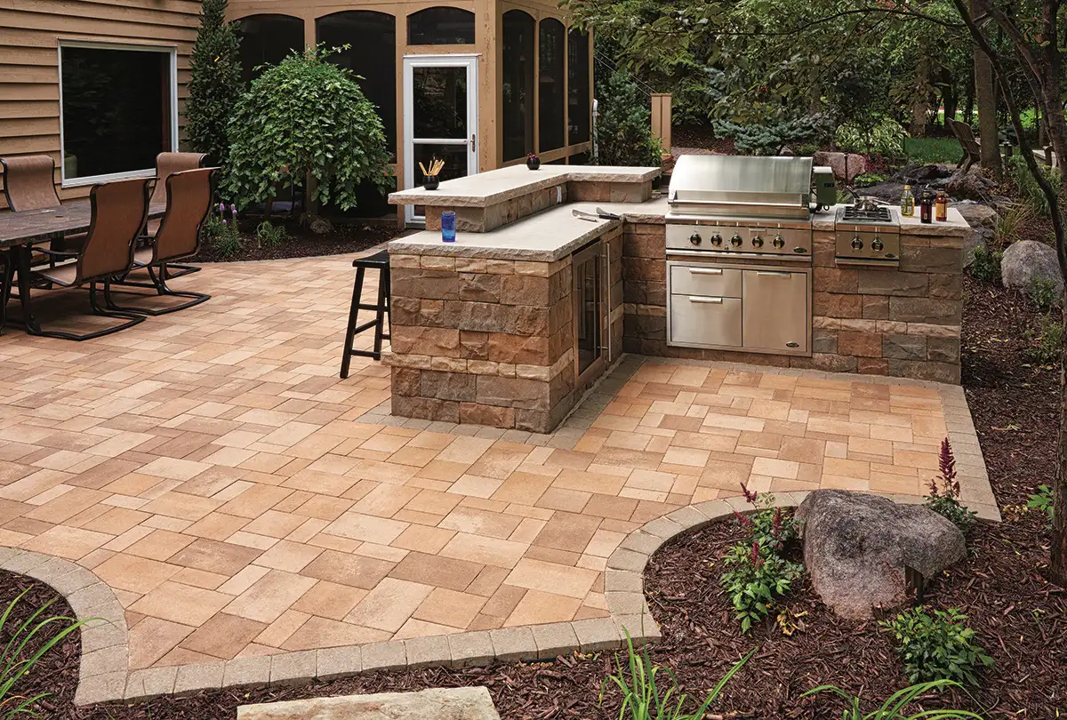 Multi-level outdoor living area with stone patio and fire feature