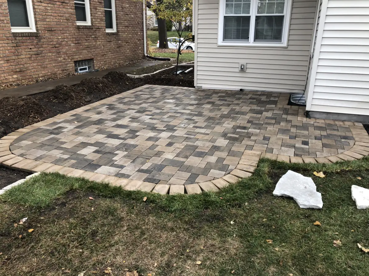 Paver patio and landscape construction suited to an established Edina home