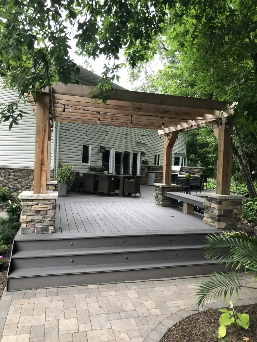 Stone column pergola on paver patio