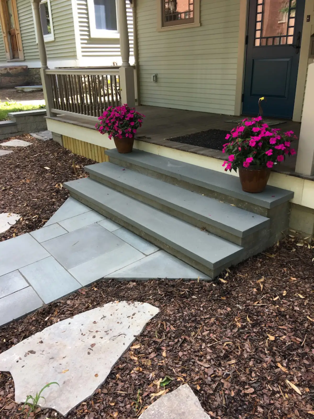 Natural stone landscape steps integrated with retaining wall in Shorewood MN