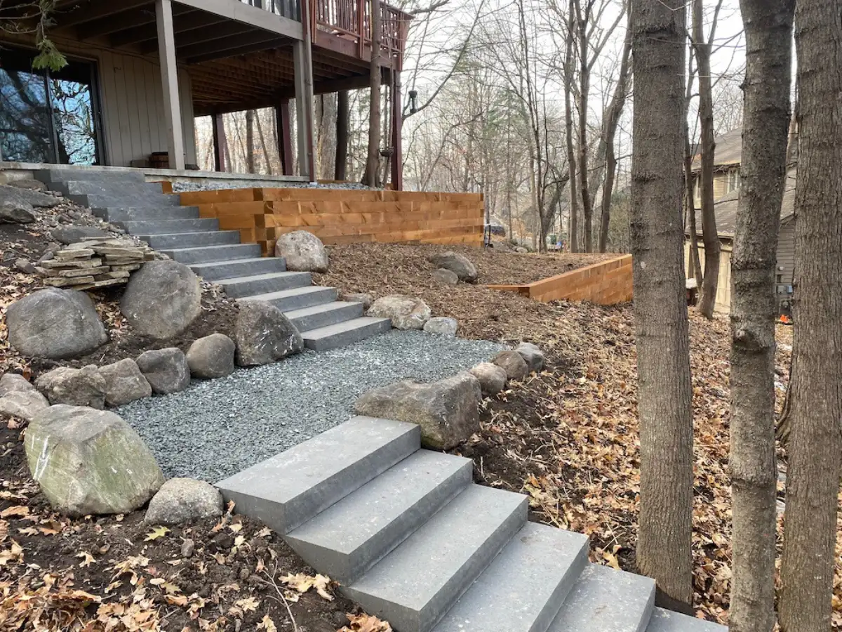 Wide landscape stairs between retaining walls